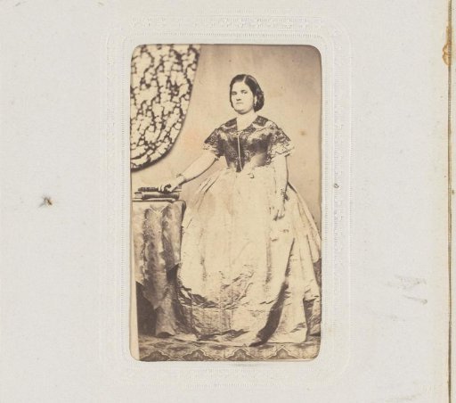 Portrait of a Woman Standing by a Table with Books
