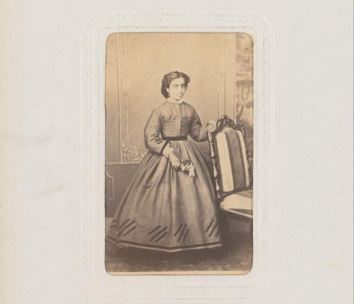 Portrait of a Woman with Flowers Standing by a Chair