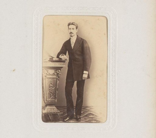 Portrait of a Man Standing by a Pillar with a Book