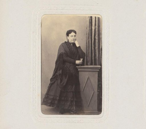 Portrait of a Woman Leaning on a Pillar