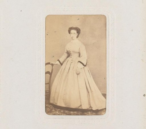 Portrait of a Woman Standing by a Chair