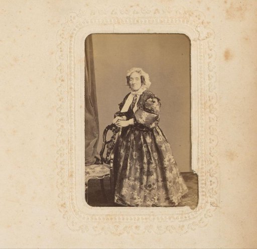 Portrait of an Old Woman with a Cap, Standing by a Chair