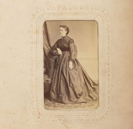Portrait of a Woman Standing by a Chair