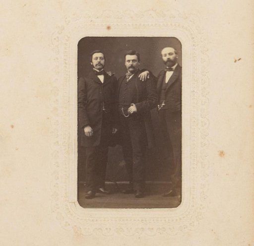 Group portrait with three standing men