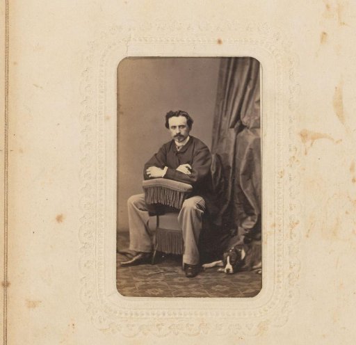 Portrait of a seated man with a mustache