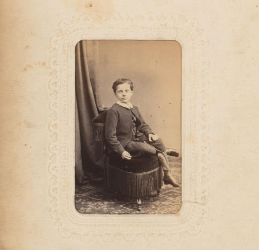 Portrait of a Boy Sitting on a Chair
