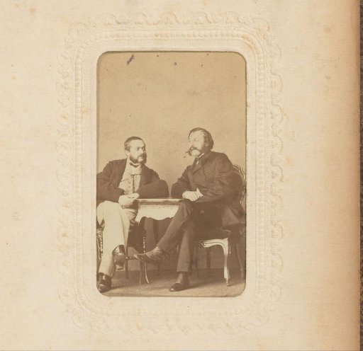Portrait of Two Men Sitting at a Table
