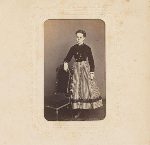 Portrait of a Young Woman Standing by a Chair
