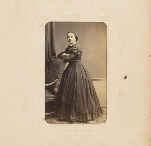 Portrait of a Woman Standing by a Chair