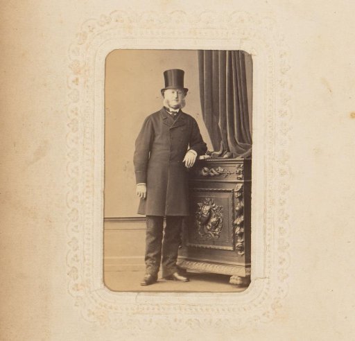Portrait of a standing man with a tall hat