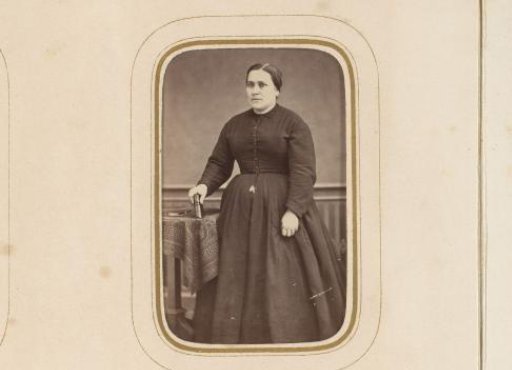 Portrait of a standing woman with a book