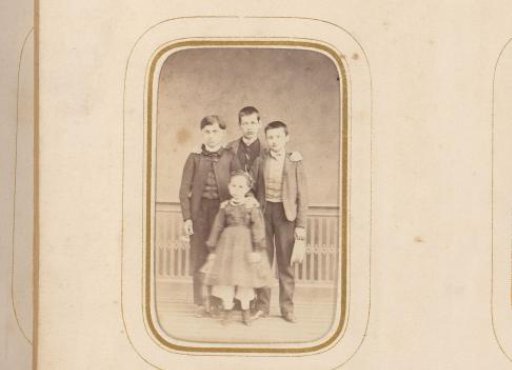 Group portrait with three boys and a girl