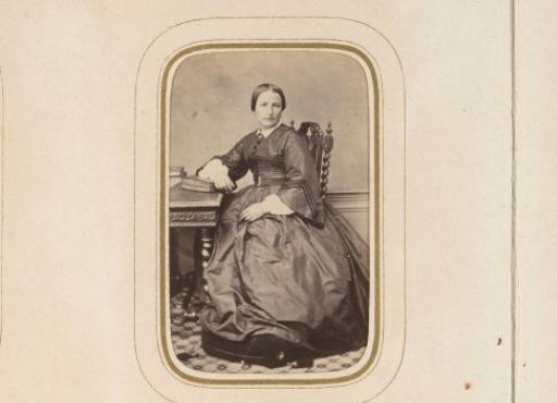 Portrait of a seated woman with books