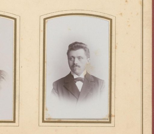 Portrait of a man with a mustache and a bow tie