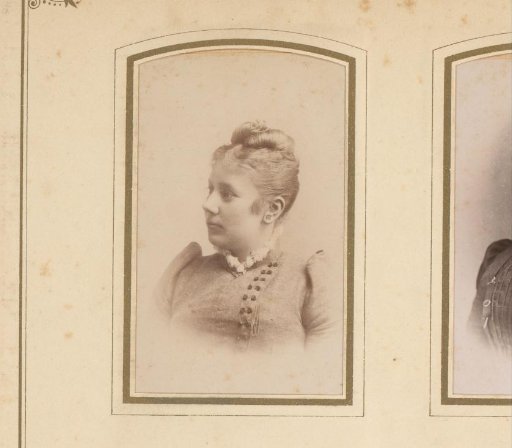 Portrait of a woman with earrings and hair pinned up