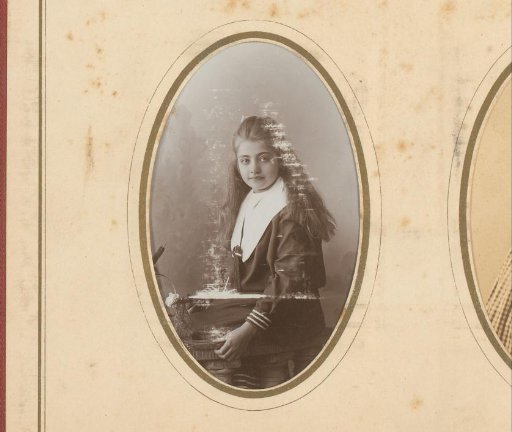 Portrait of a girl seated on a balustrade