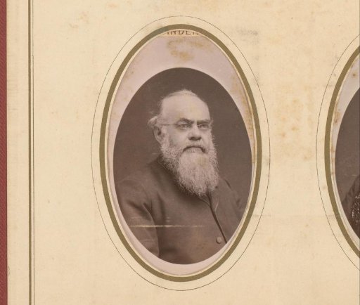 Portrait of a man with a mustache, beard, and spectacles