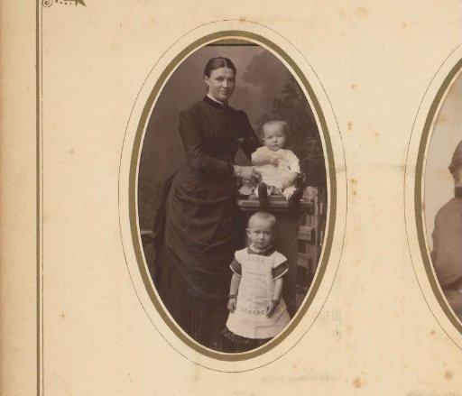 Portrait of a standing woman with two children