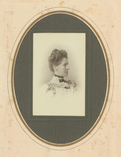 Portrait of a woman in a high-closed dress