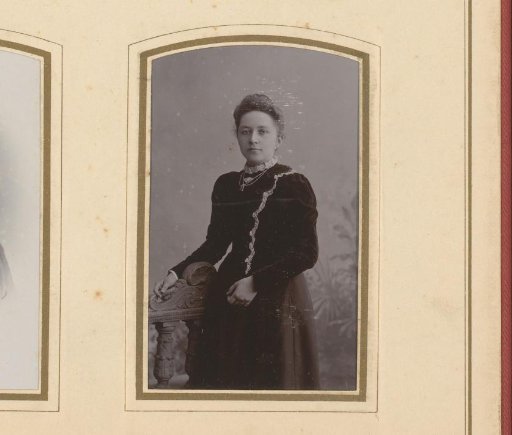 Portrait of a woman standing by a balustrade