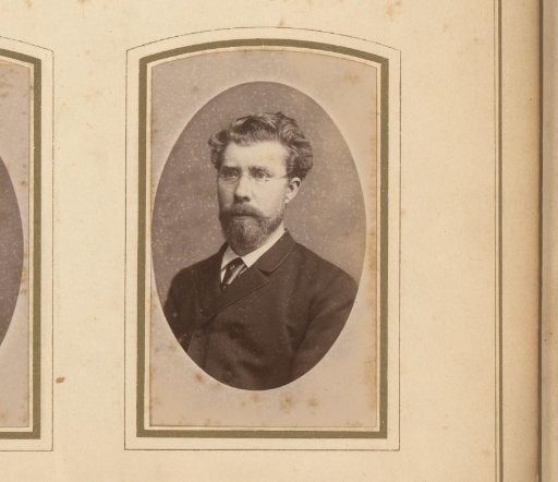 Portrait of a man with a mustache, beard, and spectacles