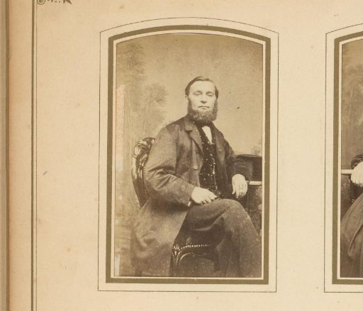 Portrait of a seated man with a beard