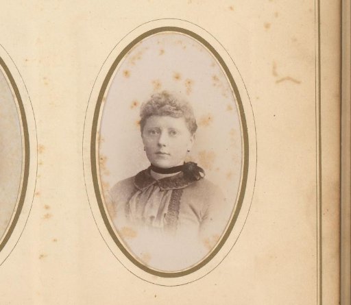 Portrait of a young woman with a ribbon around her neck