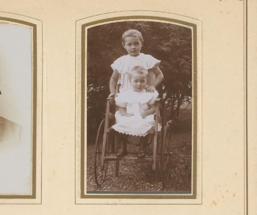 Portrait of Two Girls in White Dresses in a Garden