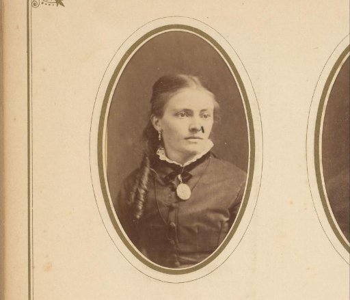 Portrait of a woman with ringlets and a necklace with a medallion
