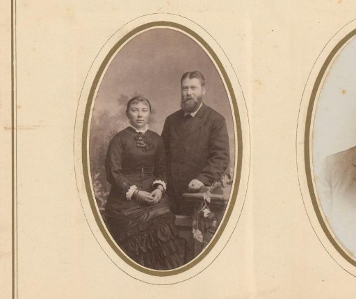 Portrait of a woman and a man at a balustrade with flowers