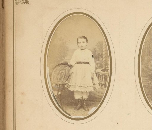 Portrait of a girl, standing by a chair