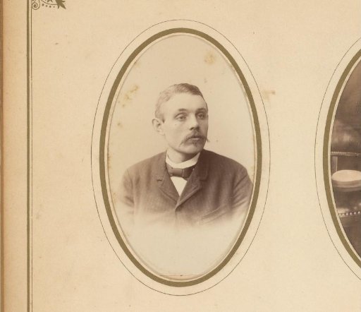 Portrait of a man with a mustache and bow tie
