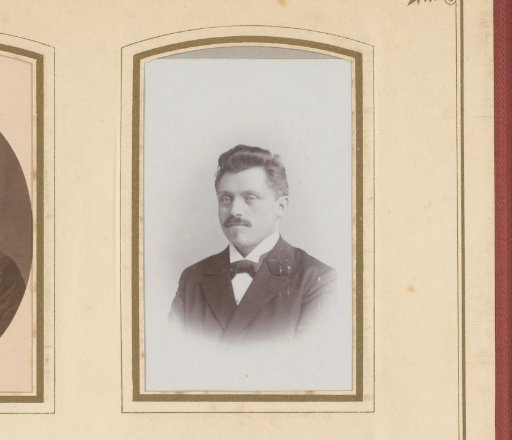 Portrait of a man with a mustache and a bow tie