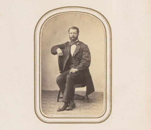 Portrait of a seated man with a beard
