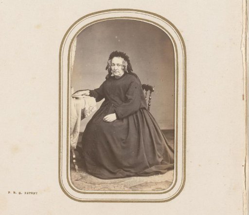 Portrait of a seated woman with a book in her hand