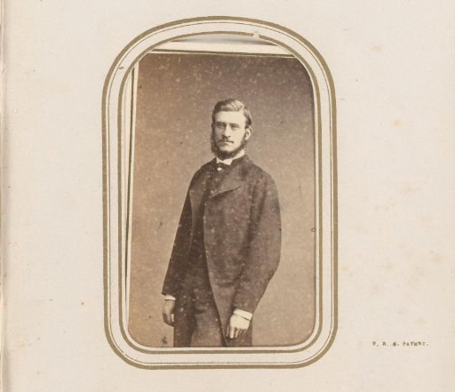 Portrait of a standing man with a beard