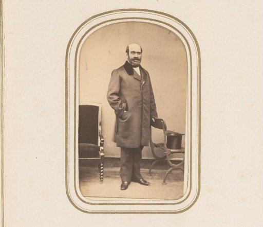 Portrait of a standing man with a beard