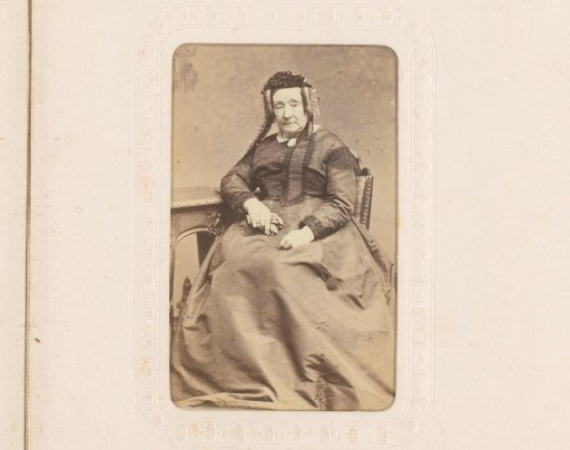Portrait of a Woman with Cap, Seated at a Table