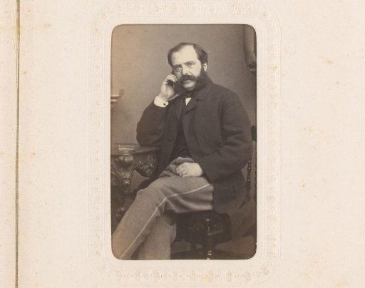 Portrait of Hein Scholten, seated at a table
