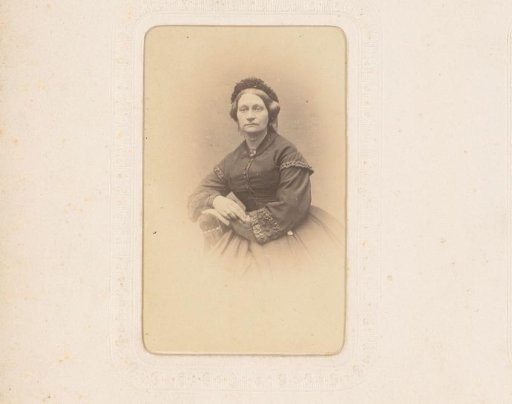 Portrait of a seated woman with a cap