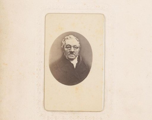 Portrait of a man with sideburns and spectacles