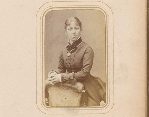 Portrait of a Young Woman Leaning on the Back of a Chair