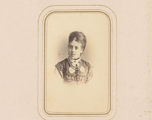Portrait of a young woman with earrings and a necklace