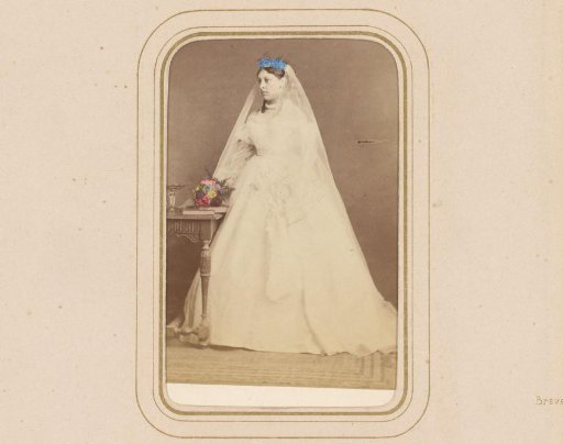 Portrait of a standing woman in a wedding dress