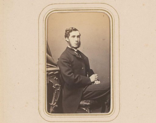 Portrait of a seated man with a beard