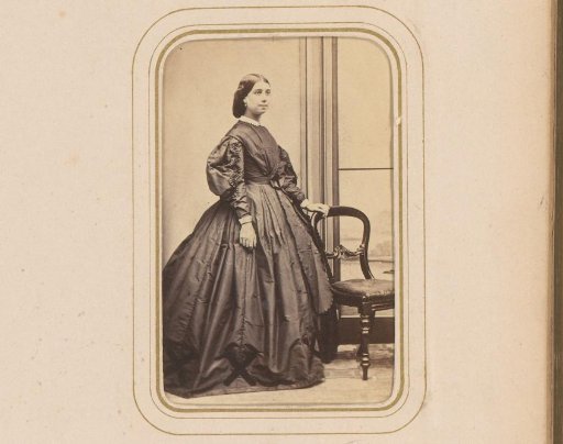Portrait of a Woman Standing by a Chair