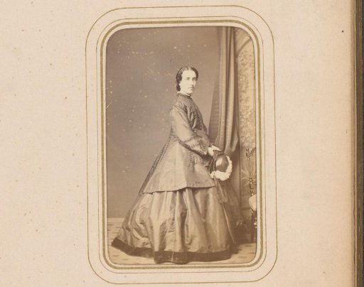 Portrait of a Standing Woman with Hat in Hand