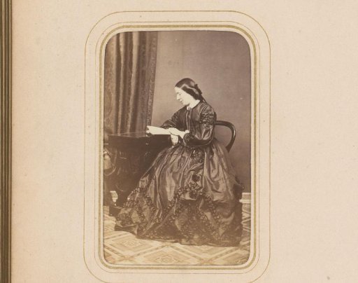 Portrait of a Reading Woman Sitting at a Table