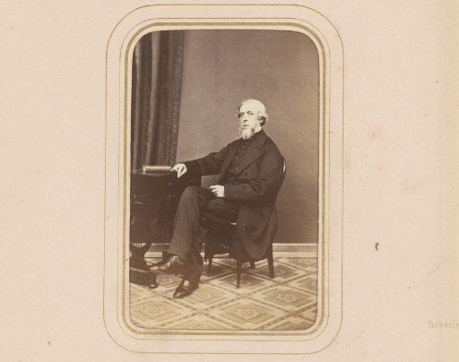 Portrait of a Bearded Man Sitting at a Table