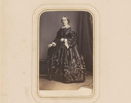 Portrait of a Woman Standing by a Chair